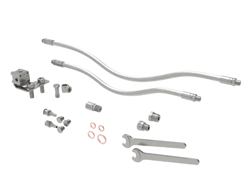 Assorted metal pipe fittings and wrenches
