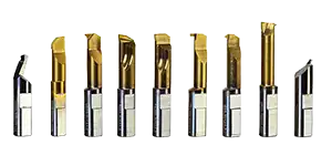 Various metal router bits arranged in a row.